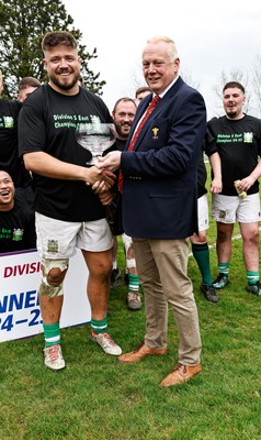 260425 - Tredegar Ironsides v Magor - Admiral National League 5 East - Colin Wilks of the WRU presents the league trophy to club captain Zac Davies