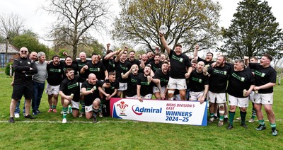 260425 - Tredegar Ironsides v Magor - Admiral National League 5 East - Club captain Zac Davies and his team celebrate with the league trophy