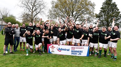 260425 - Tredegar Ironsides v Magor - Admiral National League 5 East - Club captain Zac Davies and his team celebrate with the league trophy