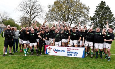 260425 - Tredegar Ironsides v Magor - Admiral National League 5 East - Club captain Zac Davies and his team celebrate with the league trophy