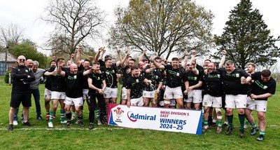 260425 - Tredegar Ironsides v Magor - Admiral National League 5 East - Club captain Zac Davies and his team celebrate with the league trophy