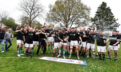 260425 - Tredegar Ironsides v Magor - Admiral National League 5 East - Club captain Zac Davies and his team celebrate with the league trophy