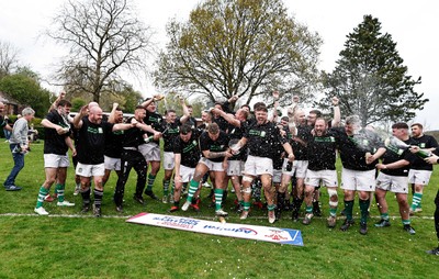 260425 - Tredegar Ironsides v Magor - Admiral National League 5 East - Club captain Zac Davies and his team celebrate with the league trophy
