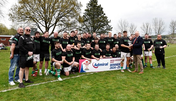 260425 - Tredegar Ironsides v Magor - Admiral National League 5 East - Colin Wilks of the WRU presents the league trophy to club captain Zac Davies