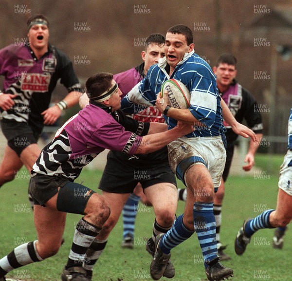 010397 - Treorchy v Bridgend - SWALEC Cup - Jason Forster of Bridgend is tackled by Carl Hammans