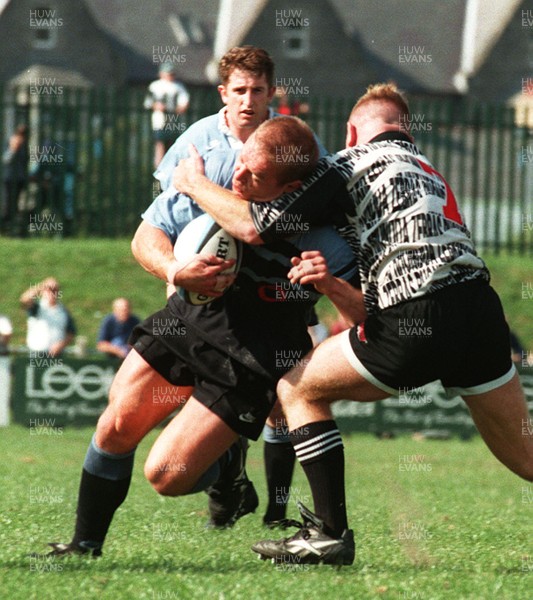 140996 - Treorchy v Cardiff - Mark Bennett of Cardiff is tackled by Julian Collins