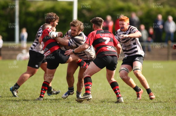 150417 - Treorchy RFC v Dowlais RFC - WRU  Division 1 East Central - Garyn Daniel of Treorchy is tackled by Darryl Jenkins of Dowlais  