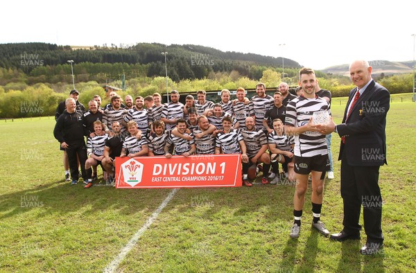 150417 - Treorchy RFC v Dowlais RFC - WRU  Division 1 East Central - Captain of Treorchy Jordan Lloyd receives the League trophy from Robert Butcher of WRU  