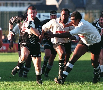 011195 - Treorchy v Fiji - Andrew Thomas of Treorchy breaks past Waisiki Masirewa