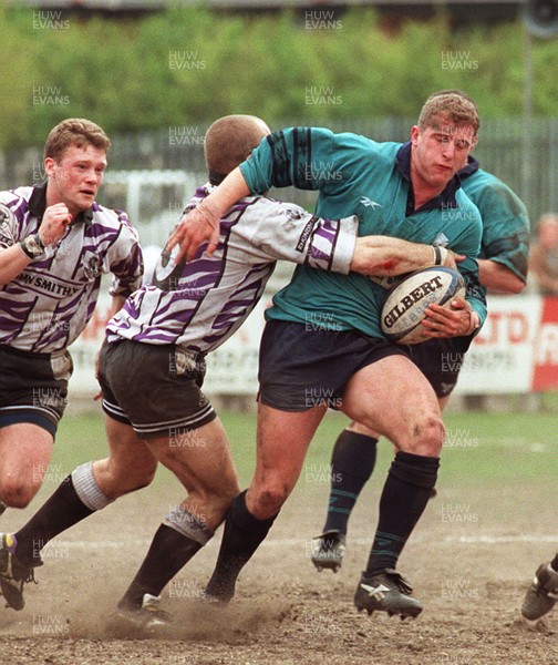 110596 - Treorchy v Neath - Leigh Davies of Neath is tackled by Paul Jones