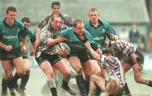 110596 - Treorchy v Neath - Ian Boobyer of Neath is tackled by Paul Jones (left) and Chris Rees