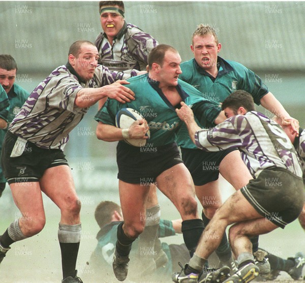 110596 - Treorchy v Neath - Ian Boobyer of Neath is tackled by Paul Jones (left) and Chris Rees