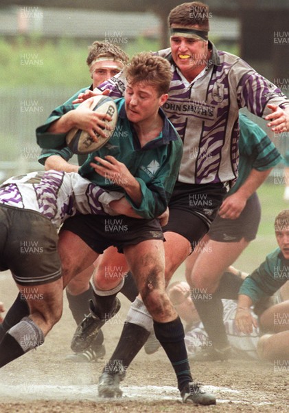 110596 - Treorchy v Neath - Patrick Horgan of Neath is tackled by David Evans and Aaron Freeman