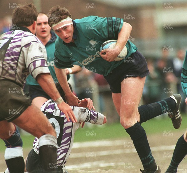 110596 - Treorchy v Neath - Steve Williams of Neath is tackled by David Evans