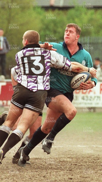 110596 - Treorchy v Neath - Leigh Davies of Neath is tackled by Paul Jones