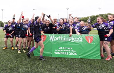 310526 - Treorchy Women celebrate as they win the Worthington’s Mid District Trophy Final
