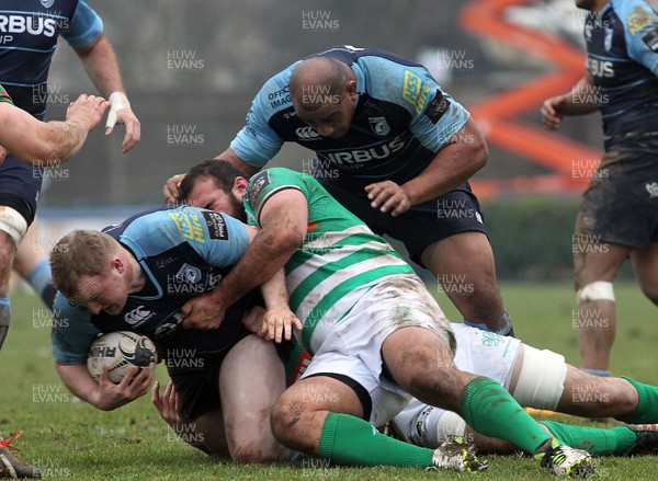 130216 - Treviso v Cardiff Blues - Guinness PRO12 -  Ethan Lewis tackled by Matteo Muccignat