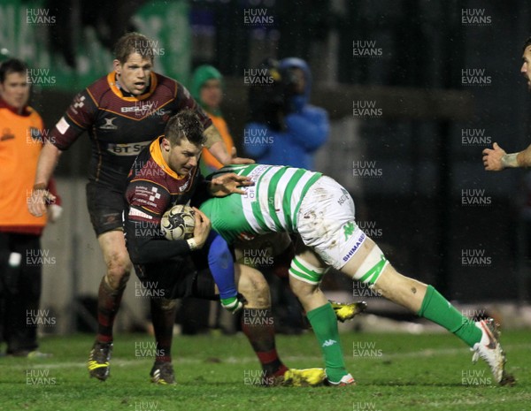 190216 - Treviso v Dragons - Guinness Pro 12 -Dragons' Carl Meyer is halted by the Treviso defence