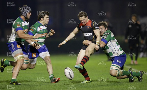 28 03 15 - Benetton Treviso v Newport Gwent Dragons - Guinness Pro12 -Hallam Amos kicks the ball as he is tackled by Rupert Harden