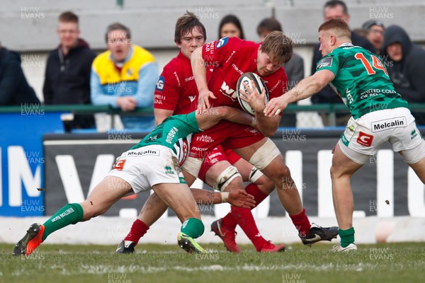 110218 - Benetton Treviso v Scarlets - Guinness Pro14 - Round 14 - Will Boyde is tackled by Tommaso Iannone and Andrea Bronzini