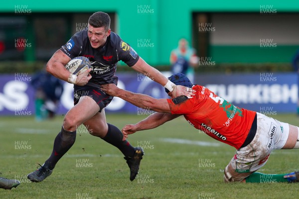 161217 - Benetton Treviso v Scarlets - European Rugby Champions Cup -  Scott Williams of Scarlets is tackled by Dean Budd of Benetton Treviso 