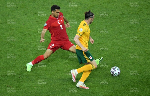 160621 - Turkey v Wales - Euro 2020 - Group A - Gareth Bale of Wales is challenged by Zeki Celik of Turkey