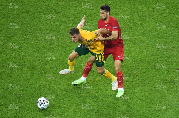 160621 - Turkey v Wales - Euro 2020 - Group A - Aaron Ramsey of Wales is challenged by Kenan Karaman of Turkey