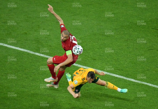 160621 - Turkey v Wales - Euro 2020 - Group A - Connor Roberts of Wales is tackled by Burak Yilmaz of Turkey