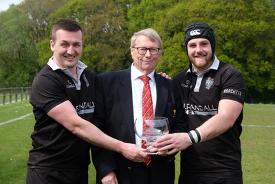260425 - Pontyberem v Tycroes - Admiral National League 3 West - Captains Shaun James and Shaun Jones of Tycroes receive the trophy from Chris Jones of the WRU