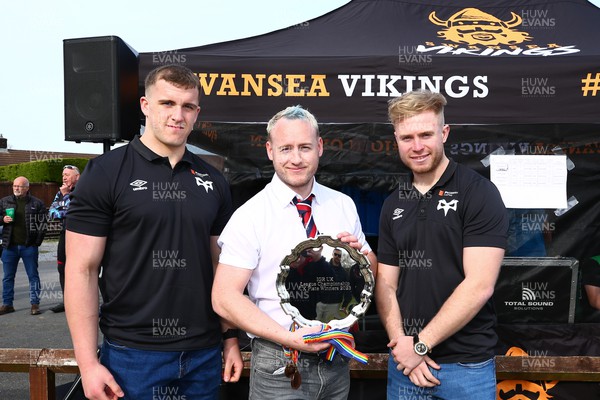 150423 - UK International Gay Rugby Grand Finals - Martin Peters of Liverpool Titans receives the League Plate from Morgan Morse and Mathew Protheroe of Ospreys