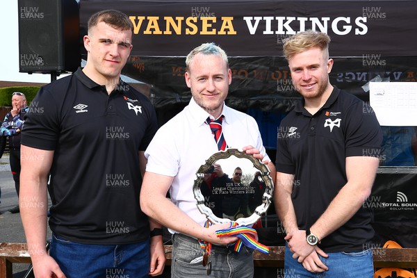 150423 - UK International Gay Rugby Grand Finals - Martin Peters of Liverpool Titans receives the League Plate from Morgan Morse and Mathew Protheroe of Ospreys
