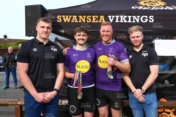 150423 - UK International Gay Rugby Grand Finals - Vice Captain James Woodward and captain Alisdair Clipston of Leeds Hunters receive the runners up medals from Morgan Morse and Mathew Protheroe of Ospreys