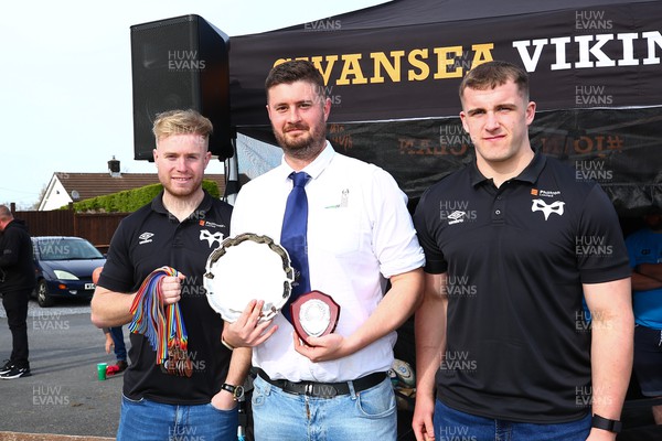 150423 - UK International Gay Rugby Grand Finals - Captain of London Stags Ben Lees receives the Southern Development League plate from Mathew Protheroe and Morgan Morse of Ospreys