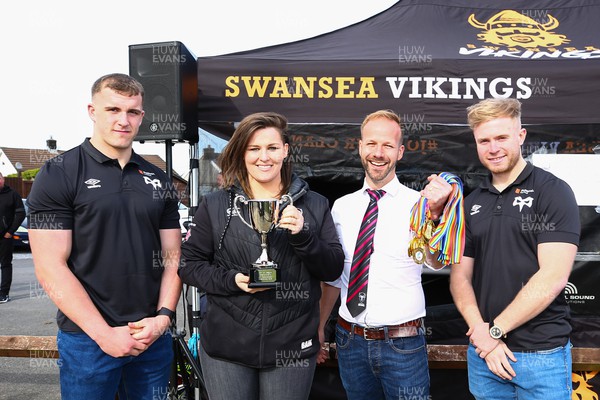 150423 - UK International Gay Rugby Grand Finals - Head Coach Sasha Acheson and captain Daryn McCombe of Bristol Bisons receive the Grand Final Development League Cup from Morgan Morse and Mathew Protheroe  of Ospreys