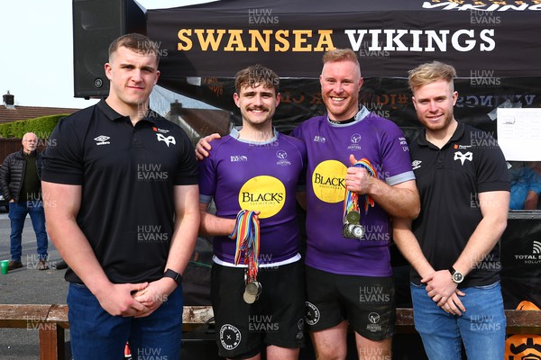 150423 - UK International Gay Rugby Grand Finals - Vice Captain James Woodward and captain Alisdair Clipston of Leeds Hunters receive the runners up medals from Morgan Morse and Mathew Protheroe of Ospreys