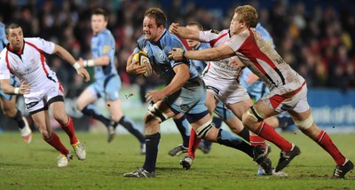 03.04.10 - Ulster v Cardiff Blues - Magners League - Xavier Rush of Cardiff Blues is tackled by Chris Henry of Ulster. 