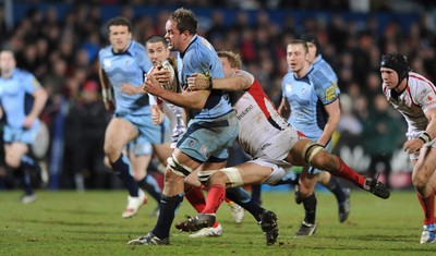 03.04.10 - Ulster v Cardiff Blues - Magners League - Xavier Rush of Cardiff Blues is tackled by Chris Henry of Ulster. 