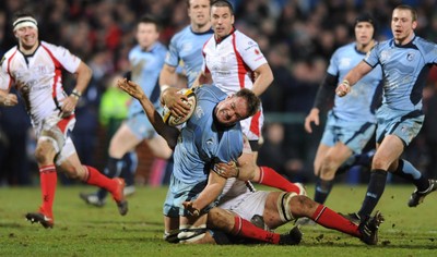 03.04.10 - Ulster v Cardiff Blues - Magners League - Xavier Rush of Cardiff Blues is tackled by Chris Henry of Ulster. 