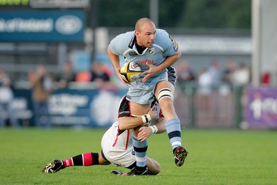 14.10.06 - Ulster v Cardiff Blues Ulster's Paddy Wallace with Mark Lewis of Cardiff 