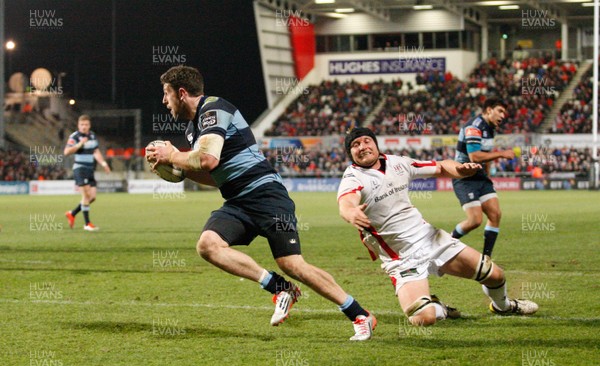 270315 - Ulster v Cardiff Blues - Guinness PRO12 - Alex Cuthbert beats the tackle of Ulster's Franco van der Merwe to score the second try for Cardiff   (c) Huw Evans Agency