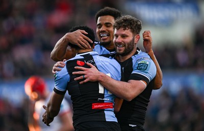 190424 - Ulster v Cardiff Rugby - United Rugby Championship - Theo Cabango of Cardiff celebrates with teammates after scoring their side's first try