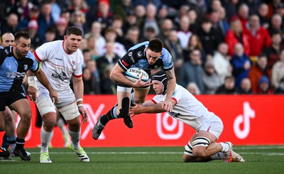 190424 - Ulster v Cardiff Rugby - United Rugby Championship - Josh Adams of Cardiff is tackled by Marcus Rea of Ulster