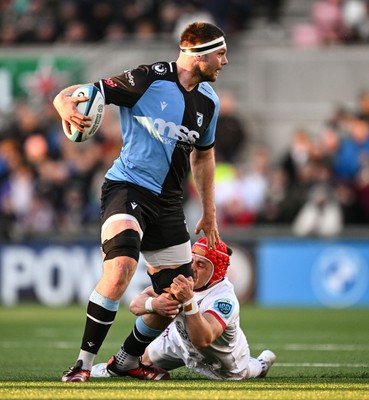 Ben Donnell of Cardiff is tackled by Mike Lowry of Ulster