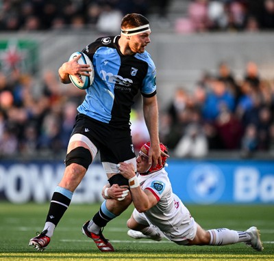 Ben Donnell of Cardiff is tackled by Mike Lowry of Ulster