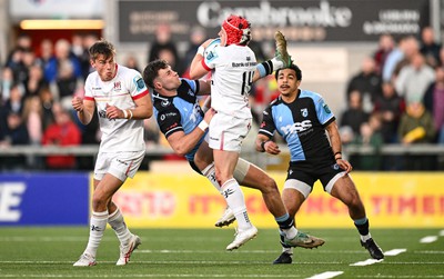 190424 - Ulster v Cardiff Rugby - United Rugby Championship - Mike Lowry of Ulster in action against Mason Grady of Cardiff