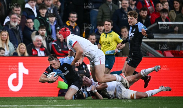 Josh Adams of Cardiff is tackled by Jude Postlethwaite of Ulster