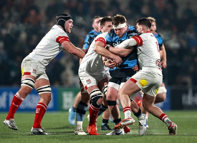 310126 - Ulster v Cardiff Rugby - United Rugby Championship - Evan Lloyd of Cardiff is tackled by Ulster players, from right, James Hume and Iain Henderson