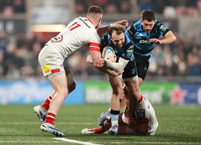310126 - Ulster v Cardiff Rugby - United Rugby Championship - Tom Bowen of Cardiff is tackled by Ulster players, from left, Zac Ward and Conor McKee