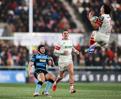 310126 - Ulster v Cardiff Rugby - United Rugby Championship - Ethan McIlroy of Ulster in action against Leigh Halfpenny of Cardiff 