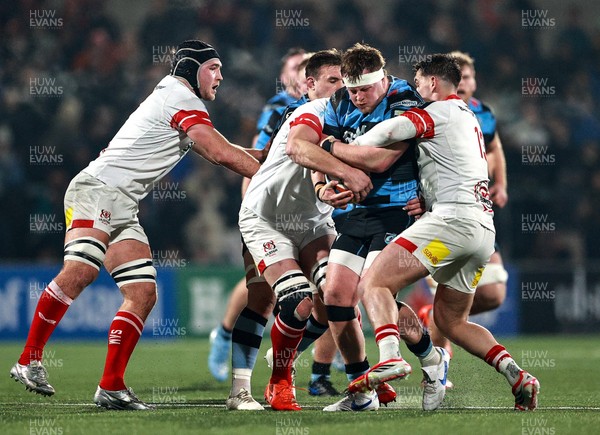 310126 - Ulster v Cardiff Rugby - United Rugby Championship - Evan Lloyd of Cardiff is tackled by Ulster players, from right, James Hume and Iain Henderson